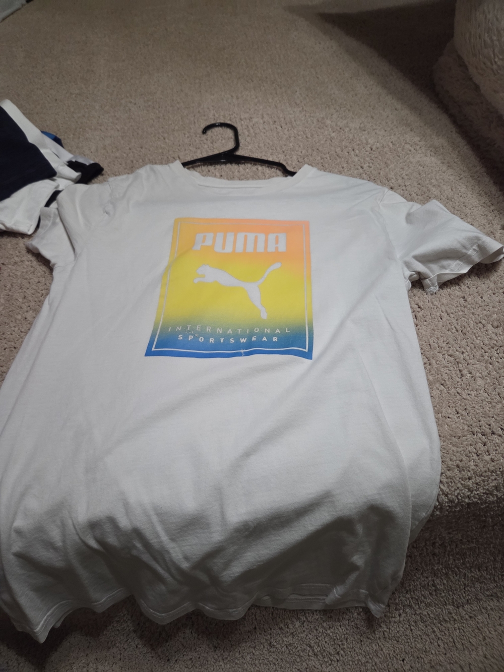 Puma White Tee with Yellow-Orange-Blue Gradient Logo
